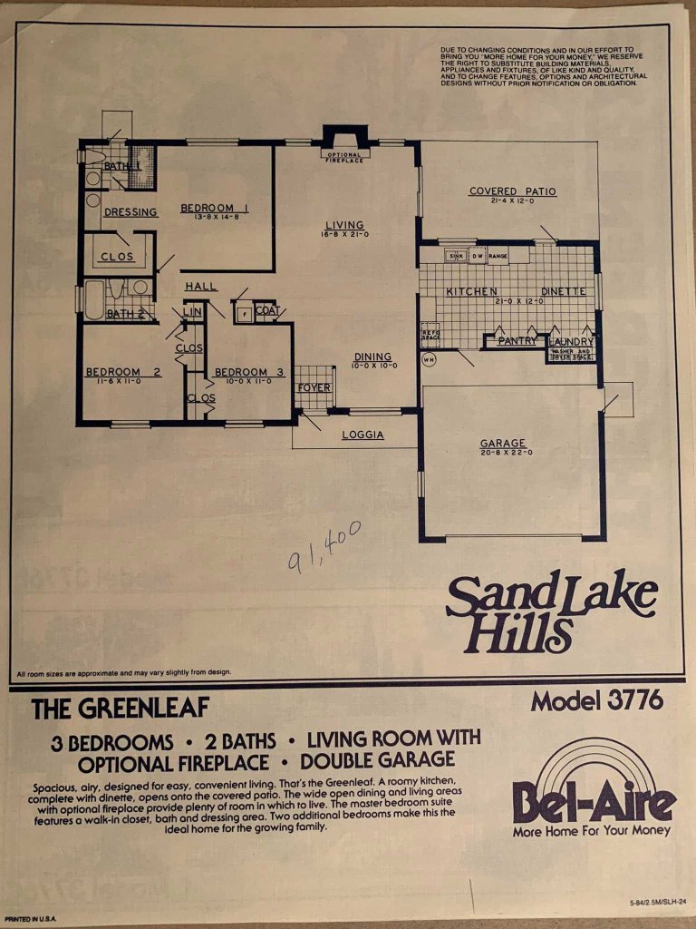 Blueprint of The Greenleaf model. Features 3 bedrooms, 2 baths, living room with optional fireplace, dining area, kitchen, and double garage. Includes details like room dimensions and layout.
